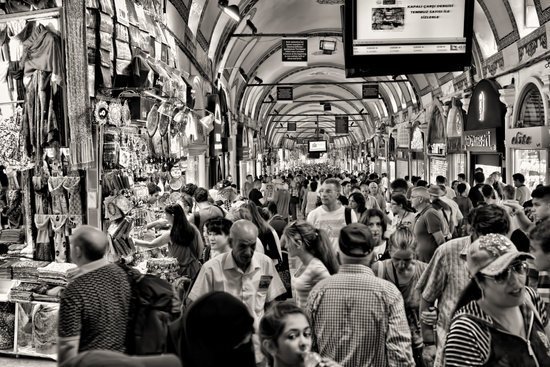 people in a market shopping 