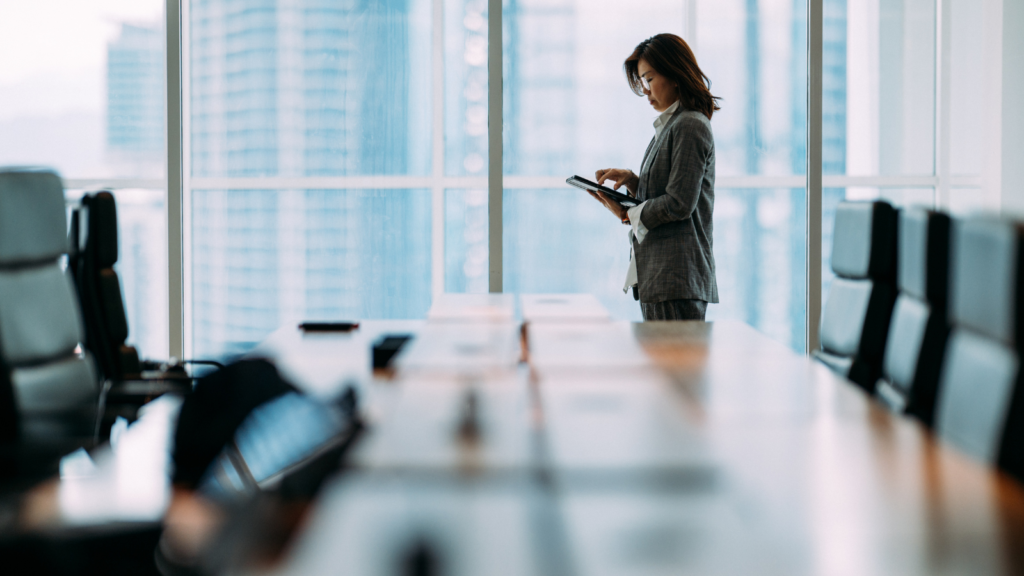 lady using ipad in boardroom